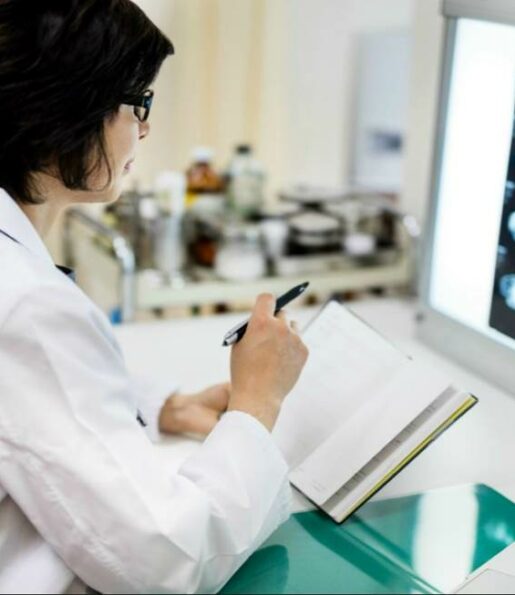 Female doctor examining mri scans in hospital Female doctor examining mri scans in hospital