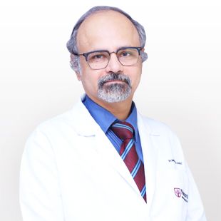 Dr. Manmohan M. Kamat